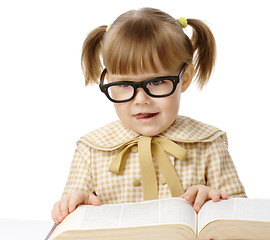 Image showing Happy little girl with book wearing black glasses