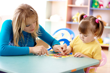 Image showing Teacher and child in preschool