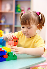 Image showing Little girl play with building bricks in preschool