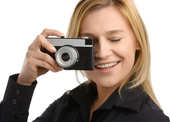 Image showing young woman taking a shot with photo camera