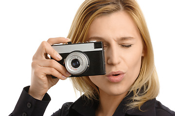 Image showing young woman taking a shot with photo camera