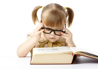 Image showing Cute little girl reading book, back to school