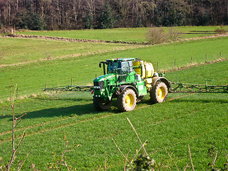 Image showing Tractor spraying