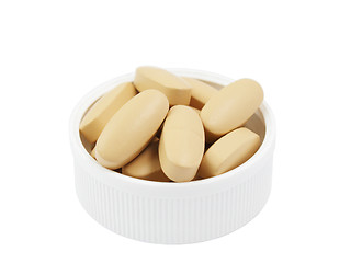 Image showing Multivitamin pills in plastic cap