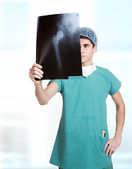 Image showing doctor holding up xrays.