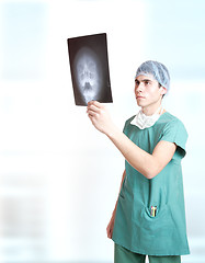 Image showing doctor holding up xrays.