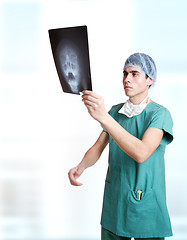 Image showing doctor holding up xrays.