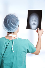 Image showing doctor holding up xrays.