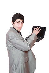 Image showing Business man displaying a laptop