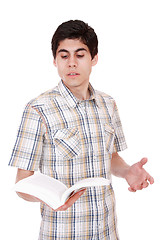 Image showing Handsome young man reading a book