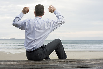 Image showing Businessman relaxing at the sea