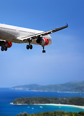 Image showing Airplane landing on tropical country