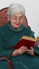 Image showing Old woman reading