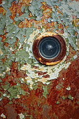 Image showing peeling door with a spy-hole