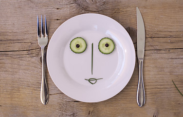 Image showing Vegetable Face on Plate - Female, Happy