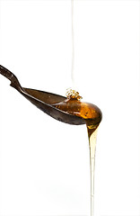 Image showing Honey poured on spoon