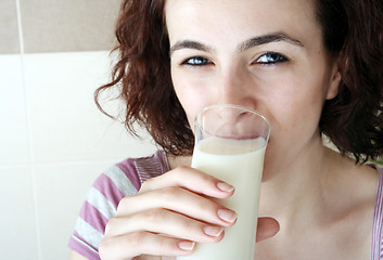 Image showing Young people eating milk with cereals