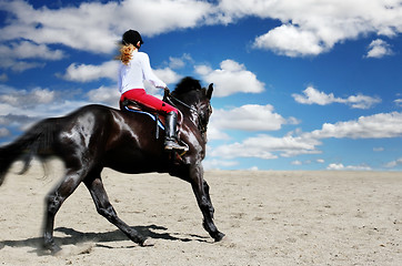 Image showing Teenage girl horseback riding