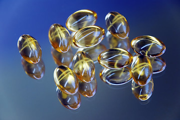 Image showing golden capsules
