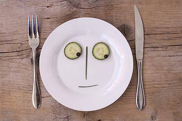 Image showing Vegetable Face on Plate - Male, Neutral, looking down