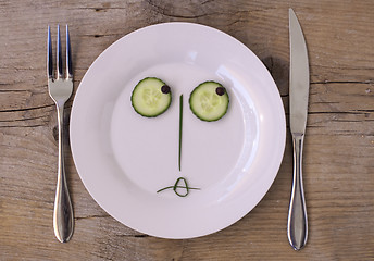 Image showing Vegetable Face on Plate - Female, sulking