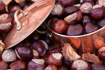 Image showing Chestnuts and copper kettle, autumn concept image
