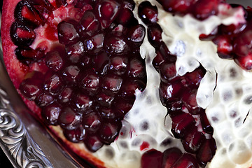 Image showing Sliced Pomegranate with arils on silver plate