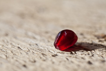 Image showing Pomegranate aril on wooden board