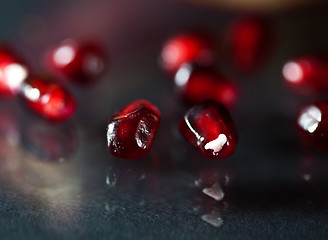 Image showing Pomegranate aril on black glass