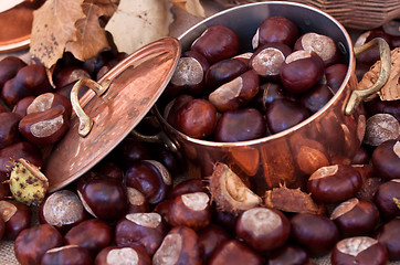 Image showing Chestnuts and copper kettle, autumn concept image