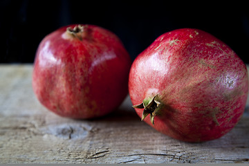 Image showing Pomegranates on wooden board