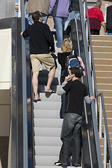 Image showing People going up in the Escalator