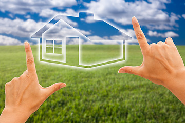 Image showing Female Hands Framing House Over Grass and Sky