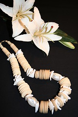 Image showing Necklace and lily