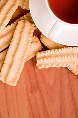 Image showing cup of tea and some cookies