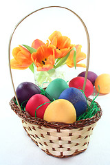 Image showing Easter basket with Easter eggs and tulips