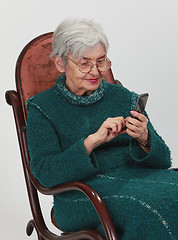 Image showing Old woman with mobile phone