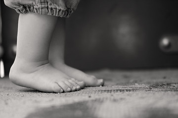 Image showing Toddler standing up on his toes