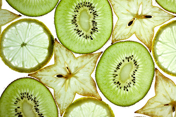 Image showing Sliced Kiwifruit, Lemon and Starfruit isolated on white