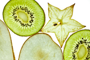 Image showing Sliced Kiwifruit, Pear and Starfruit isolated on white