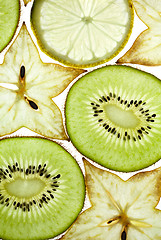 Image showing Sliced Kiwifruit, Lemon and Starfruit isolated on white