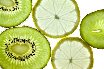 Image showing Sliced Kiwifruit, Lemon and Starfruit isolated on white