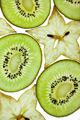 Image showing Sliced Kiwi and Carambola Starfruit isolated on white