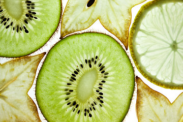 Image showing Sliced Kiwifruit, Lemon and Starfruit isolated on white