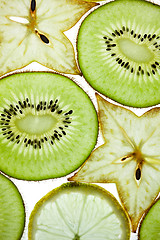 Image showing Sliced Kiwifruit, Lemon and Starfruit isolated on white