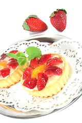 Image showing Strawberry tarts with mint