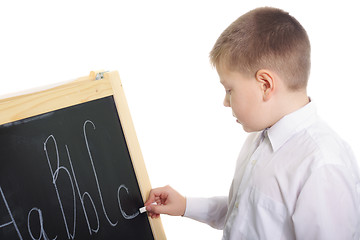 Image showing Boy writing on blackboard