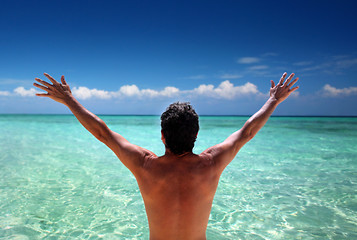 Image showing Man standing looking at ocean