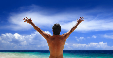 Image showing Man standing looking at ocean