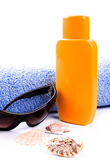 Image showing towel, shells, sunglasses and lotion